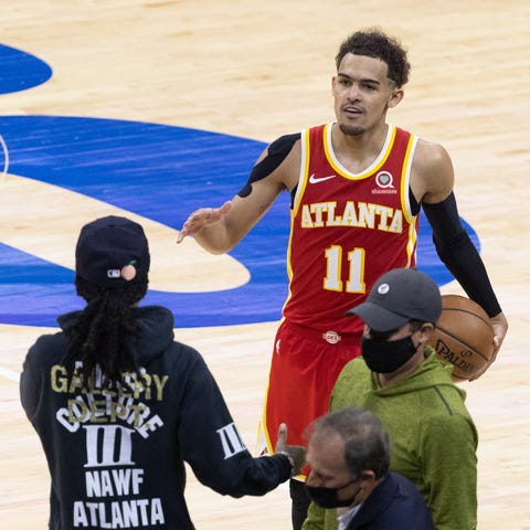Trae Young celebrates with fans after the Atlanta 