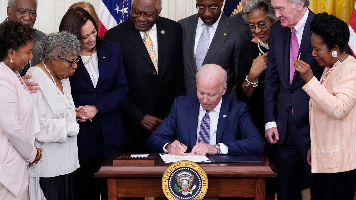 President Joe Biden signs the Juneteenth National Independence Day Act on June 17, 2021.