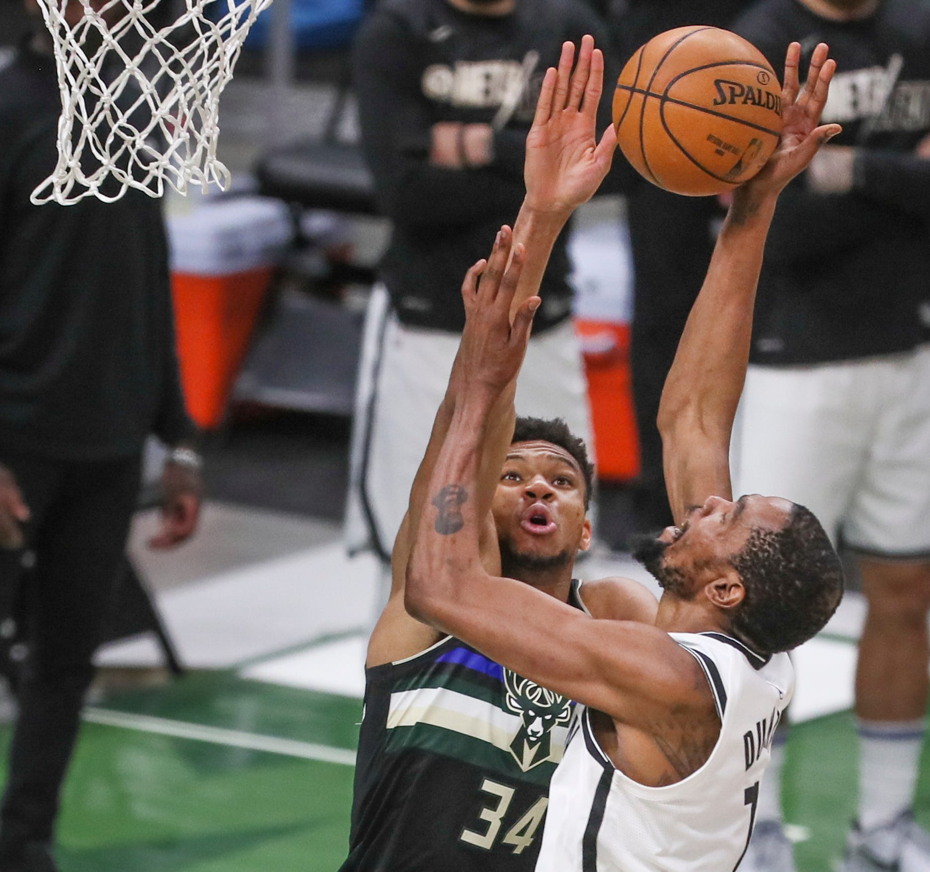 Bucks fan, Wisconsin farmer rips T-shirt at Fiserv Forum ...