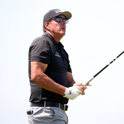 Phil Mickelson plays his shot from the 15th tee du