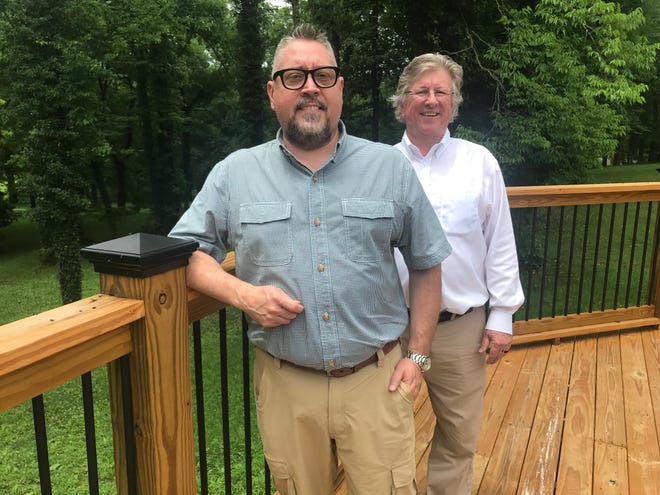 Co-chairmen of the shelter renovation project, Russell Gibbons and Dwaine Beck of The Kiwanis Club of Columbia, stand on the newly-constructed deck at the structure.