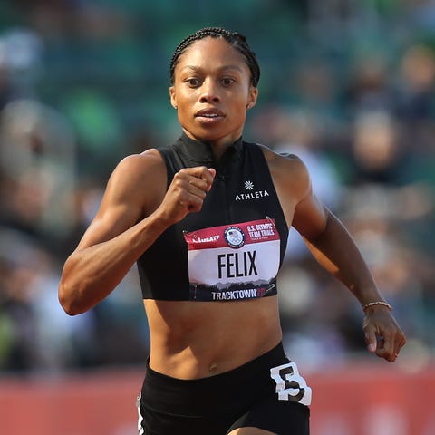 Allyson Felix wins her heat of the 400 meter run a