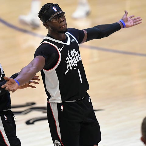 Reggie Jackson (1) and Terance Mann (14) helped th