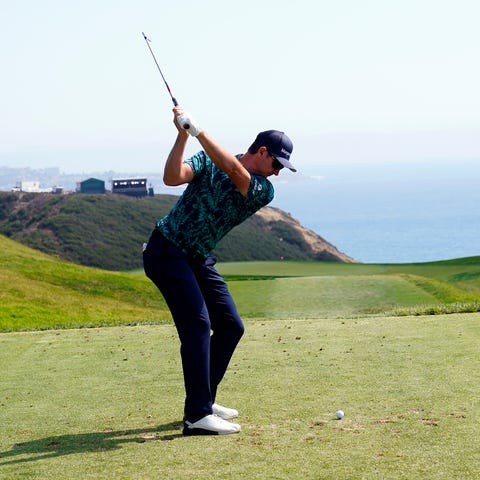 A golfer plays his shot from the third tee during 
