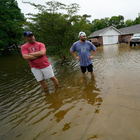 Danny Gonzales, right, stands in front of his floo