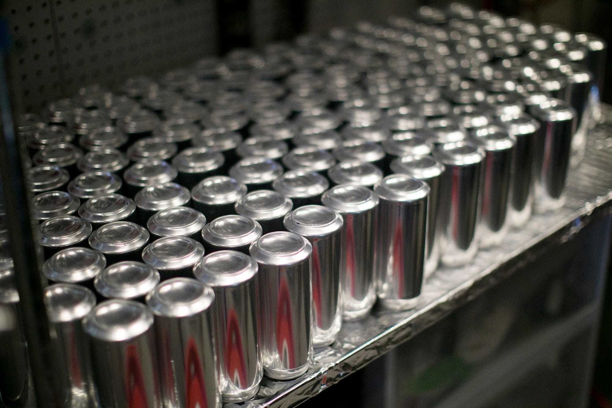 Cans wait to be filled at Lineage Brewing in Clintonville. [Courtney Hergesheimer/Dispatch]