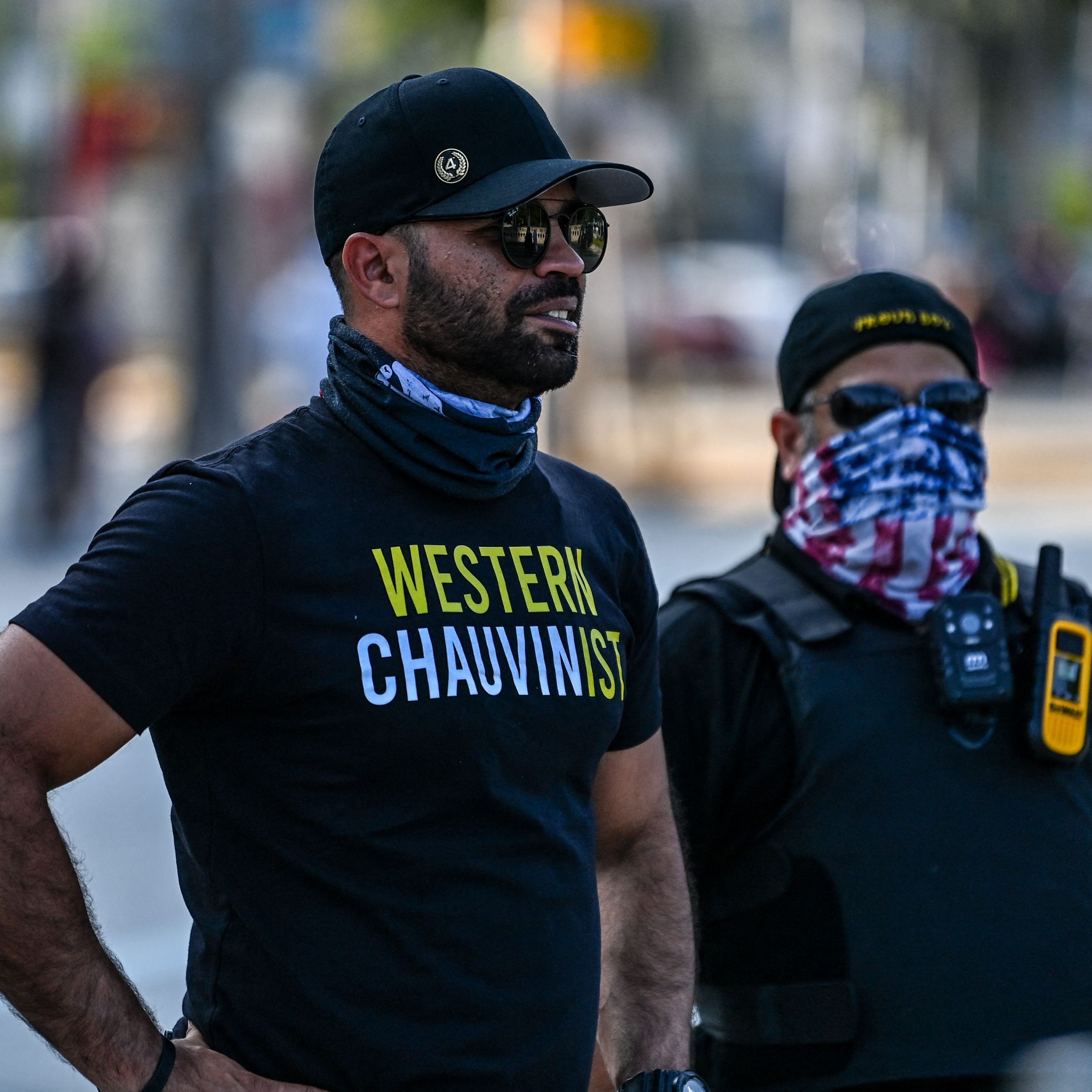 Enrique Tarrio, left, chairman of the Proud Boys, wears a shirt expressing support for Derek Chauvin in a counterprotest against a remembrance of George Floyd in Miami on May 25, the one-year anniversary of Floyd's death at the hands of police officer Chauvin.