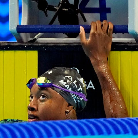 Simone Manuel reacts after swimming in the 50 free