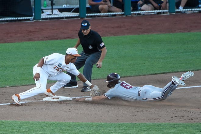 Texas Longhorns infielder Camryn Williams tags out Mississippi State Bulldogs infielder Kamren James on a steal attempt in the sixth inning at TD Ameritrade Park June 20.