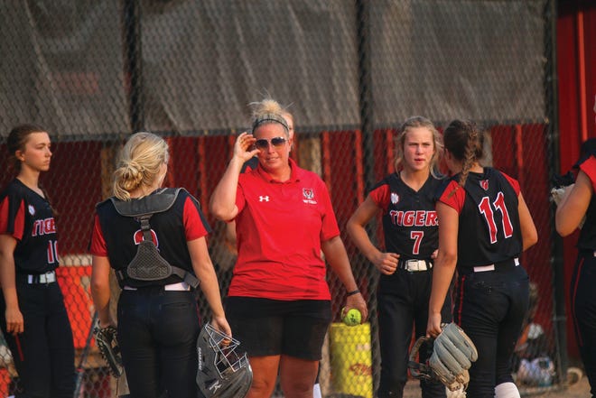 ADM softball players come together during a game against Boone on Wednesday, June 16 in Adel.