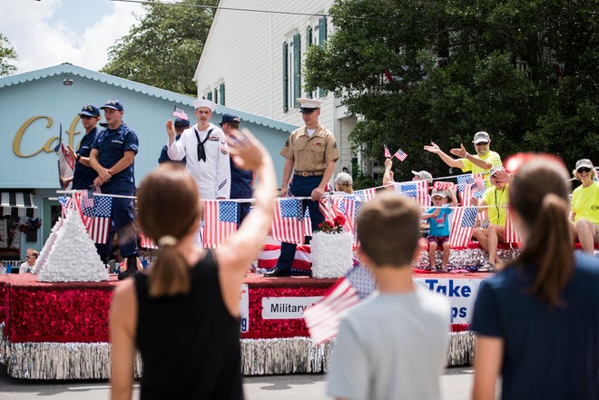 People line the streets to watch the N.C. 4th of July Festival Parade in Southport, NC in 2018. The festival is returning to in-person events but there will be no parade this year.