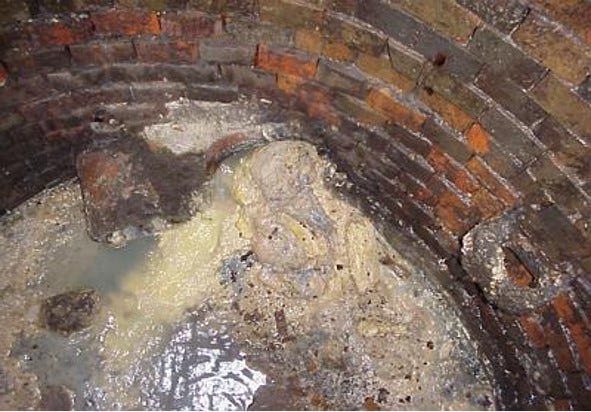 While the Metropolitan Sewerage District of Buncombe County doesn't typically see large "fatbergs" of grease that big cities experience, grease is a constant problem in sewer lines and manholes. This photo shows congealed grease in an MSD manhole.
