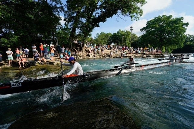 Dylan Mchardy, Phil Bowden and Brad Daniels run Rio Vista fall in a 40-foot boat while three of their teammates run around the bank during the Texas Water Safari June 12, 2021.