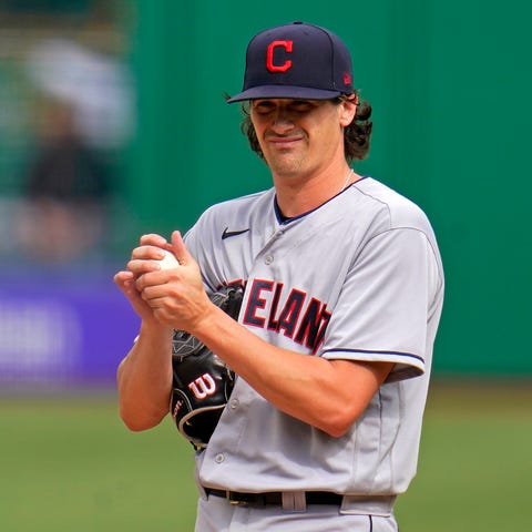 Indians starting pitcher Cal Quantrill rubs up the