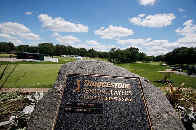 The plaque listing past winners of the Bridgestone Senior Players Tournament overlooks the first fairway at Firestone Country Club in Akron.