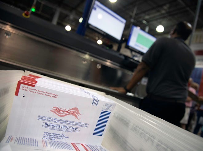 Incoming ballots are processed during a tour of the elections process at the Voting Equipment Service Center in Riviera Beach Tuesday, June 22, 2021.