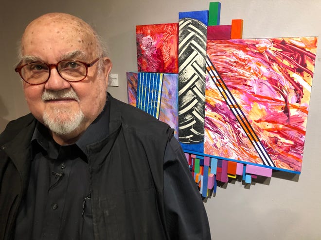 Goshen artist Abner Hershberger stands in front of his 2018 mixed media piece, "Cultivating Private Thoughts," now on display at the Midwestern Museum of American Art in Elkhart.
