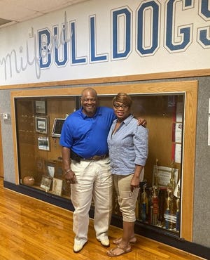 Newly-hired Milford head football coach and athletic director Isaac Wells and his wife, Coella Wells, pose for a photo at Milford High School. Wells was hired by the Milford ISD board of trustees in June.