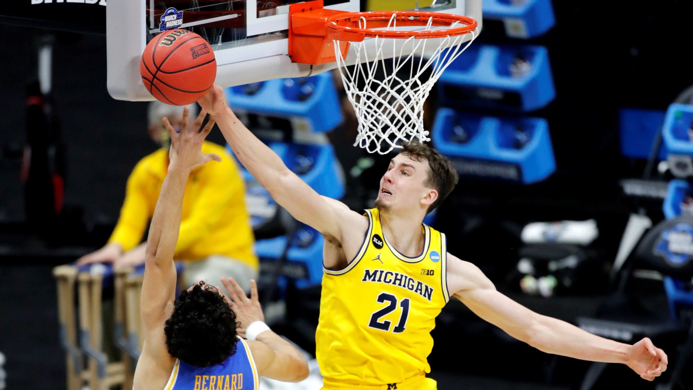 Michigan Wolverines guard Franz Wagner (21) blocks a shot by UCLA Bruins guard Jules Bernard (1) during the Elite Eight round of the 2021 NCAA Tournament on Tuesday, March 30, 2021, at Lucas Oil Stadium in Indianapolis, Ind. Mandatory Credit: Michelle Pemberton/IndyStar via USA TODAY Sports ORIG FILE ID:  20210330_jla_usa_094.jpg