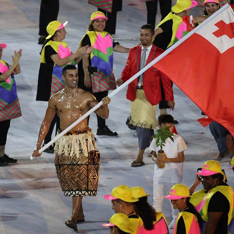 Athletes from Tonga are led by flag bearer Pita Ni