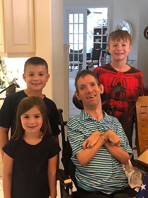 Michael Alberico, who died April 13 at age 42, with niece Gianna and nephews Anthony (rear) and Bobby.