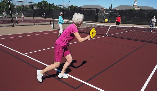 People play pickleball at courts in Portsmouth, NH.