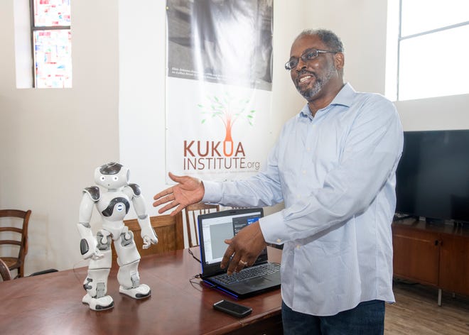 Co-founder Lloyd Reshard talks about the robot called C.H.A.R.L.I.E., which stands for connecting history and robotics learning innovation education, at the Kukua Institute in the historic Belmont-DeVilliers neighborhood of downtown Pensacola on Wednesday, June 23, 2021. The institute will be offering a summer program for children to learn history through some of the most advanced technologies.