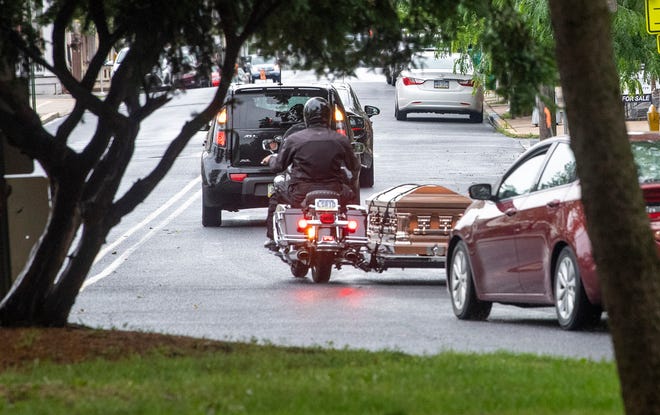The funeral procession for Roy A. Kleinfelter winds down Chestnut Street in Lebanon on Tuesday.