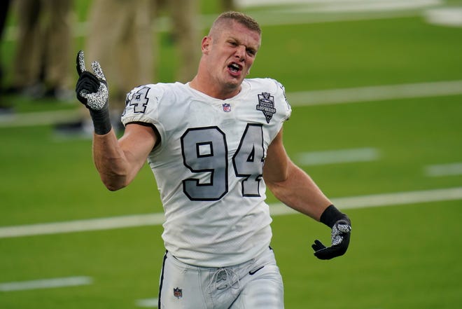 FILE - In this Nov. 8, 2020, file photo, Las Vegas Raiders defensive end Carl Nassib reacts after the Raiders defeated the Los Angeles Chargers in an NFL football game, in Inglewood, Calif. "To Carl Nassib and Kumi Yokoyama â€“ two prominent, inspiring athletes who came out this week: Iâ€™m so proud of your courage. Because of you, countless kids around the world are seeing themselves in a new light today," U.S. President Joe Biden tweeted. Nassib is the first active NFL player to come out as gay. (AP Photo/Alex Gallardo, File)