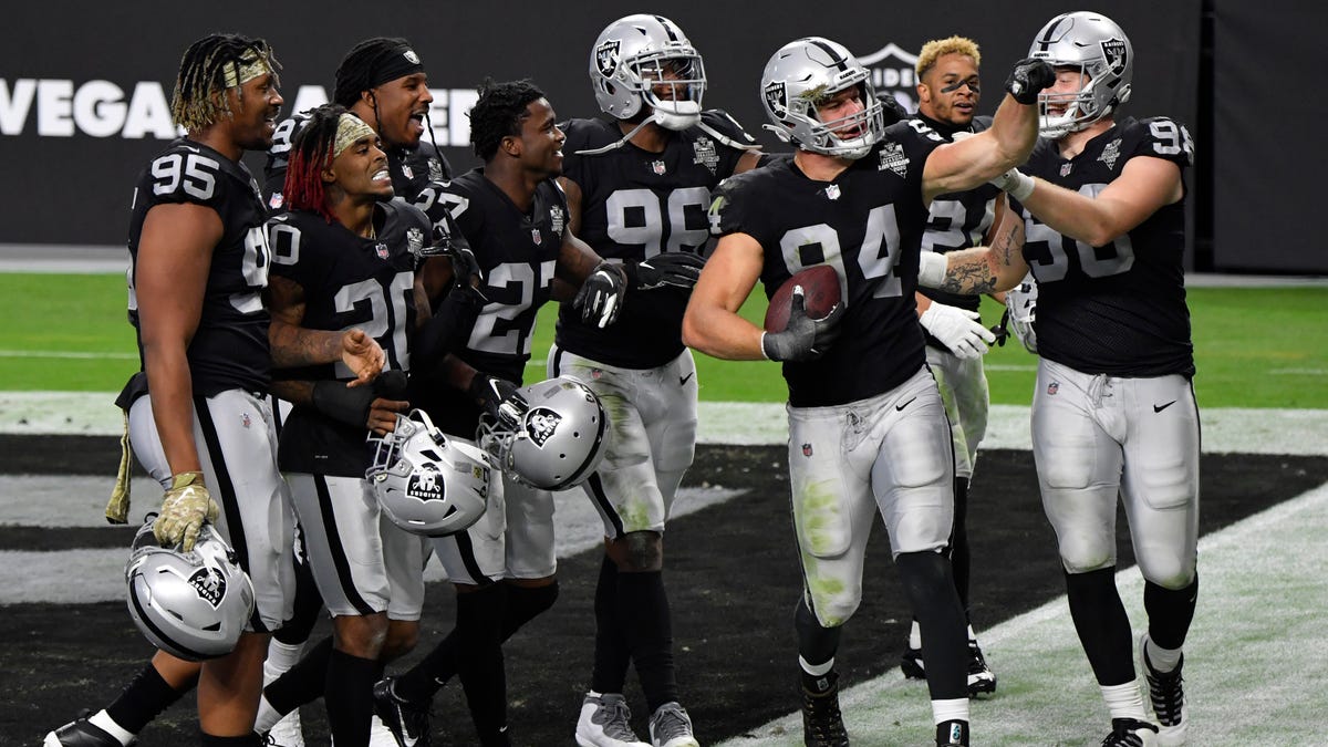 Las Vegas Raiders defensive end Carl Nassib celebrates with teammates after intercepting a pass during the second half against the Denver Broncos during an NFL football game, Sunday, Nov. 15, 2020, in Las Vegas.
