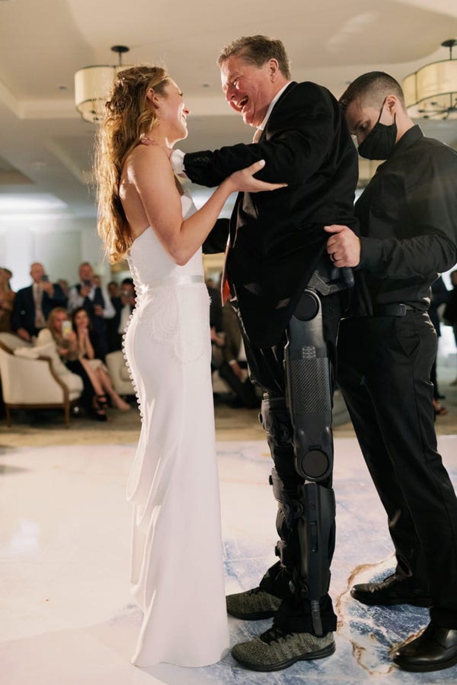 Sam Schmidt dances with his daughter, Savannah, at her wedding.
