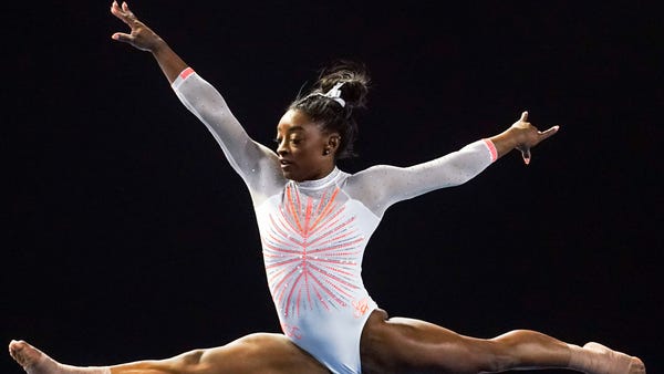 Simone Biles performs her floor routine during the