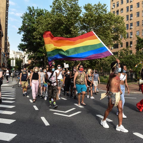 NEW YORK, NY - JULY 16:  People march in the stree