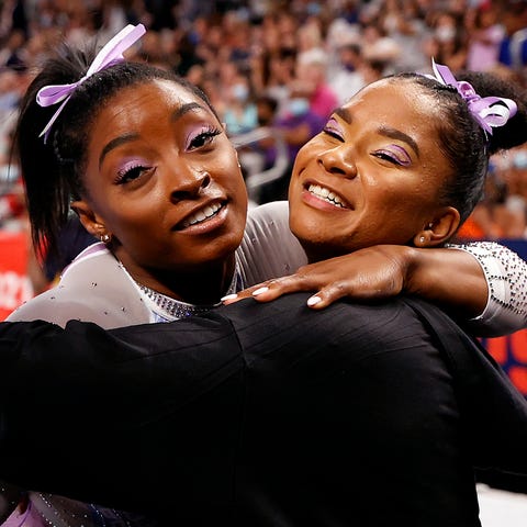 Simone Biles and Jordan Chiles embrace during the 
