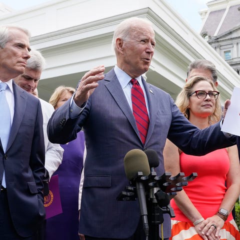 President Joe Biden, with a bipartisan group of se