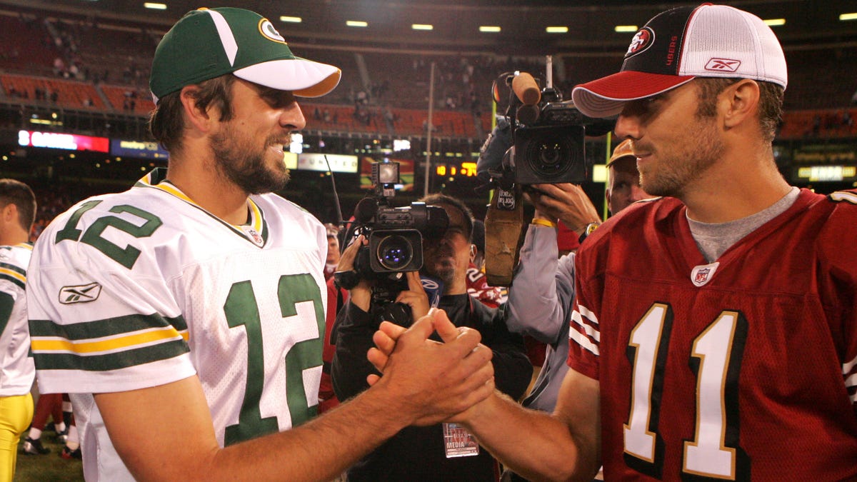 Aaron Rodgers (left) and Alex Smith were both selected in the first round of the 2005 NFL draft.
