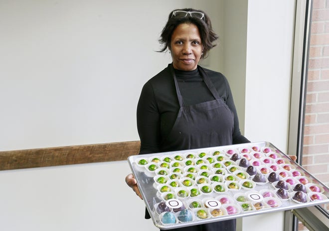 Michelle Allen, lead confectioner and owner of Mmelo Boutique Confections, fills orders for Easter in the production facility she owns in the Mettler Toledo building on Polaris Parkway in 2020.