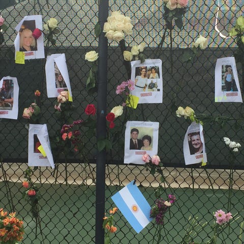 An Argentine flag was posted on a fence that is se