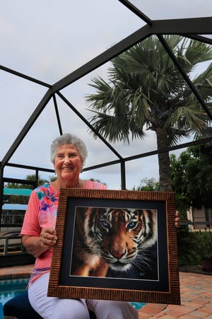 North Fort Myers resident Beverley Hutson is a passionate stitcher who has been working on intricate projects for years. She is photographed with a piece titled "Old Blue Eyes."