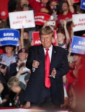 Former President Donald Trump gestures to a member of the audience at the end of his speech at a rally at the Lorain County Fairgrounds on Saturday June 26 2021 in Wellington, Ohio.