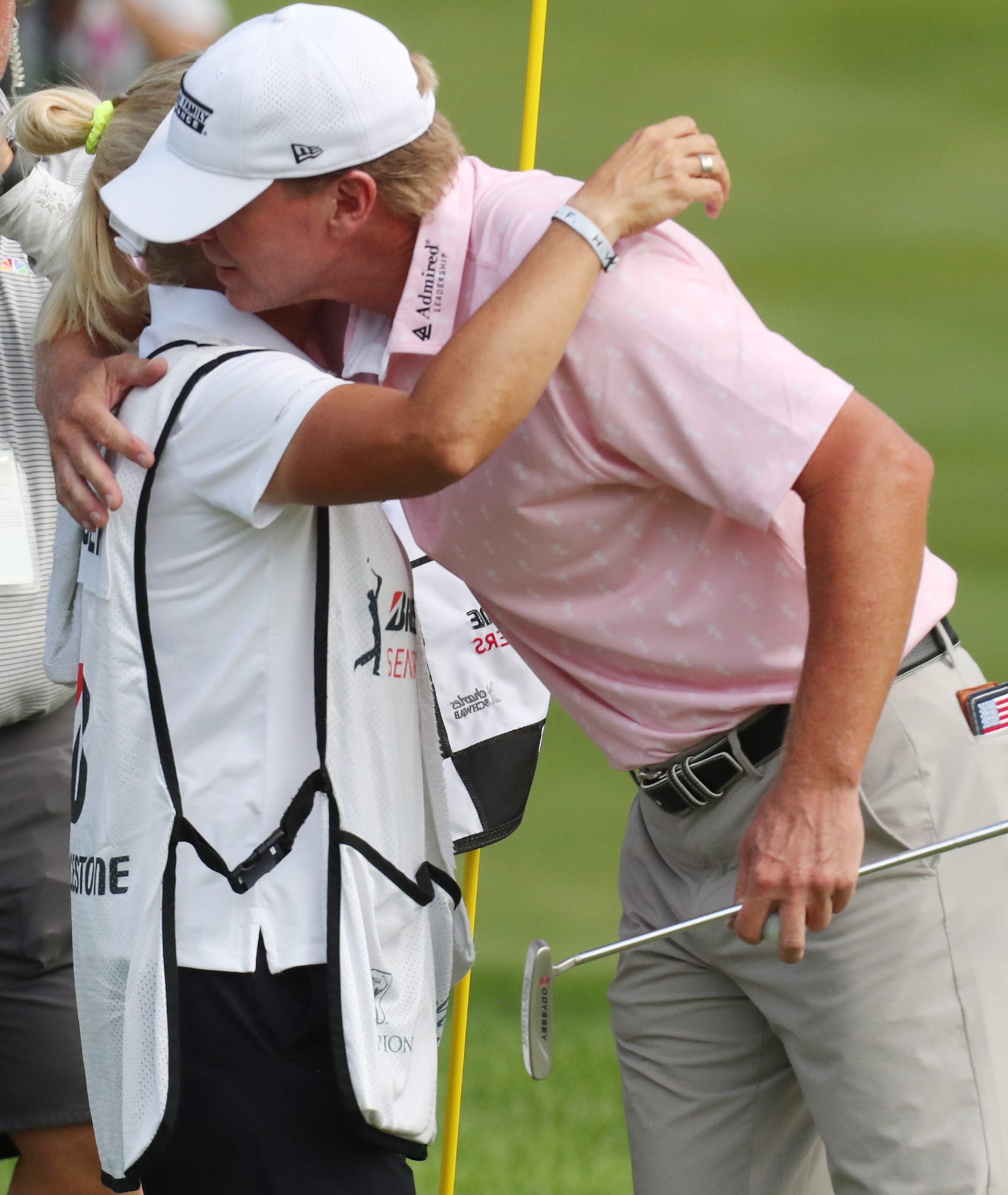 Steve Stricker hugs his wife and caddie Nicki after winning the Bridgestone Senior Players Championship at Firestone Country Club on Friday June 27, 2021 in Akron.