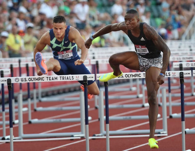 Devon Allen, left, is edged for first by Grant Holloway in the finals of th...