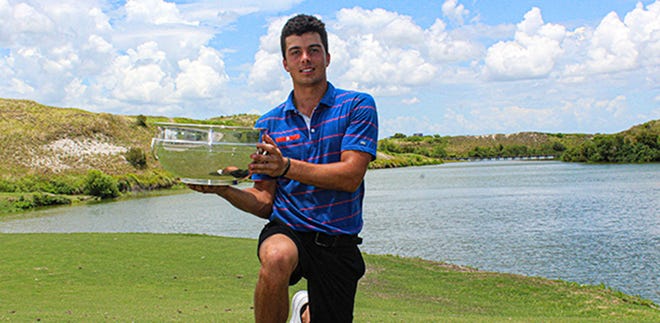 Fred Biondi holds the trophy after winning the Florida Amateur on Sunday.