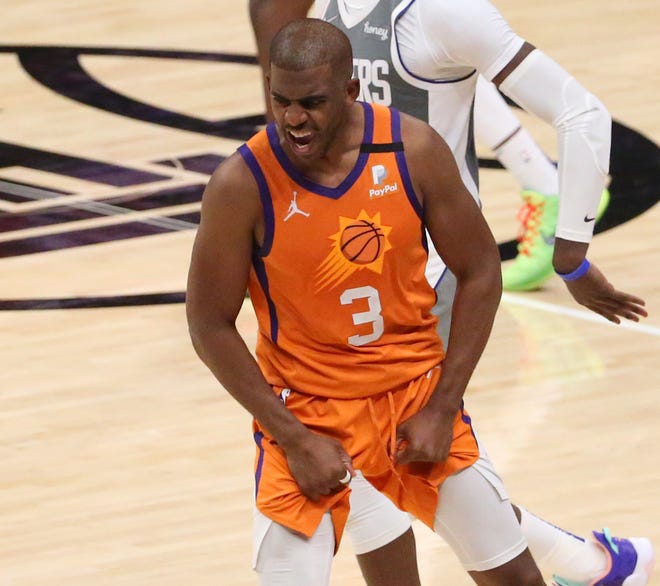 Phoenix Suns guard Chris Paul (3) celebrates after beating LA Clippers 84-80 in Game 4 at STAPLES Center June 26, 2021.