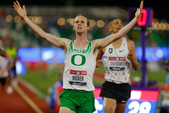 Cole Hocker throws his arms up in celebration after winning the 1,500-meter final at the U.S. Olympic Track & Field Trials at Hayward Field in June.
