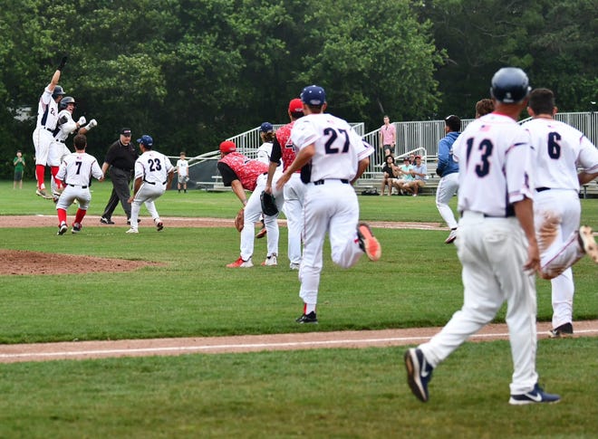 The team celebrates after a walk-off win against the Orleans Firebirds last Saturday.