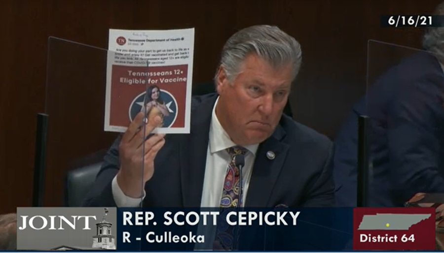 Rep. Scott Cepicky, R-Culleoka, holds up a print out of a Tennessee Department of Health Facebook post promoting vaccinations while questioning the agency on June 16. Cepicky proposed the possibility of dissolving the entire agency to stop it from "peer pressuring" teenagers to get vaccinated against coronavirus.