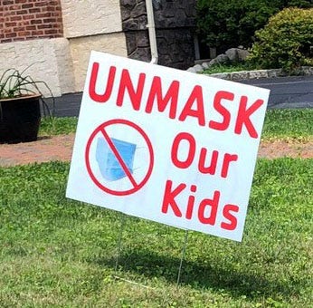 An "Unmask our kids" sign on an Essex County lawn