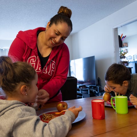 Lily Marquez, a married mother of two, makes dinne