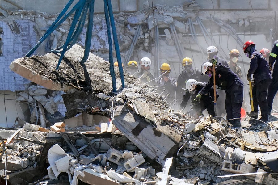 Crews work in the rubble at the Champlain Towers South Condo, Sunday, June 27, 2021, in Surfside, Fla.